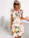 Coral – Elegante vestido vaporoso con volantes
