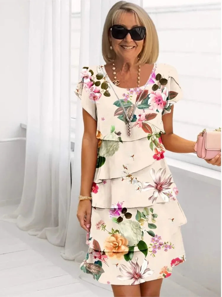 Coral – Elegante vestido vaporoso con volantes